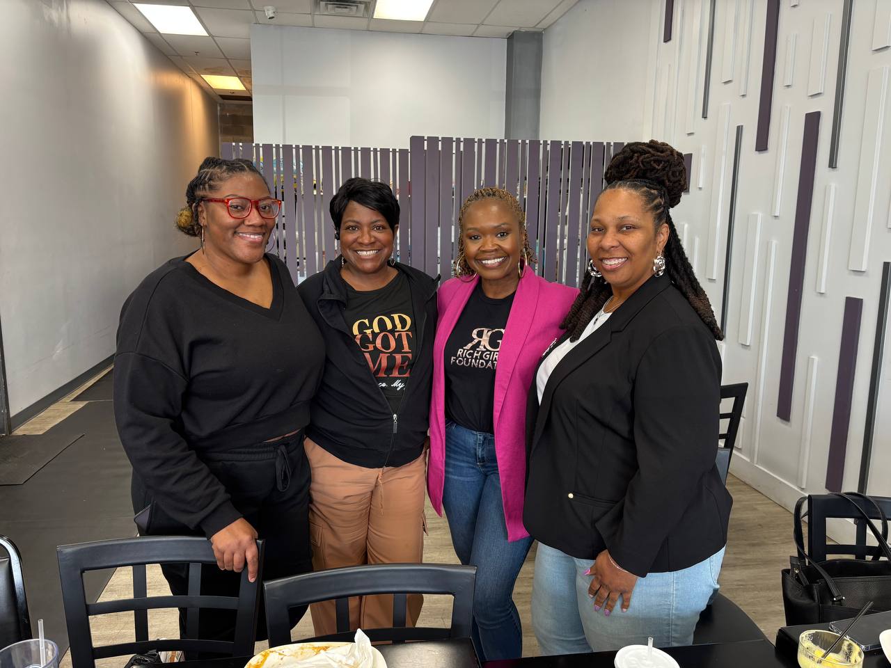 Rich Girls Foundation representatives and volunteers together at a community gathering