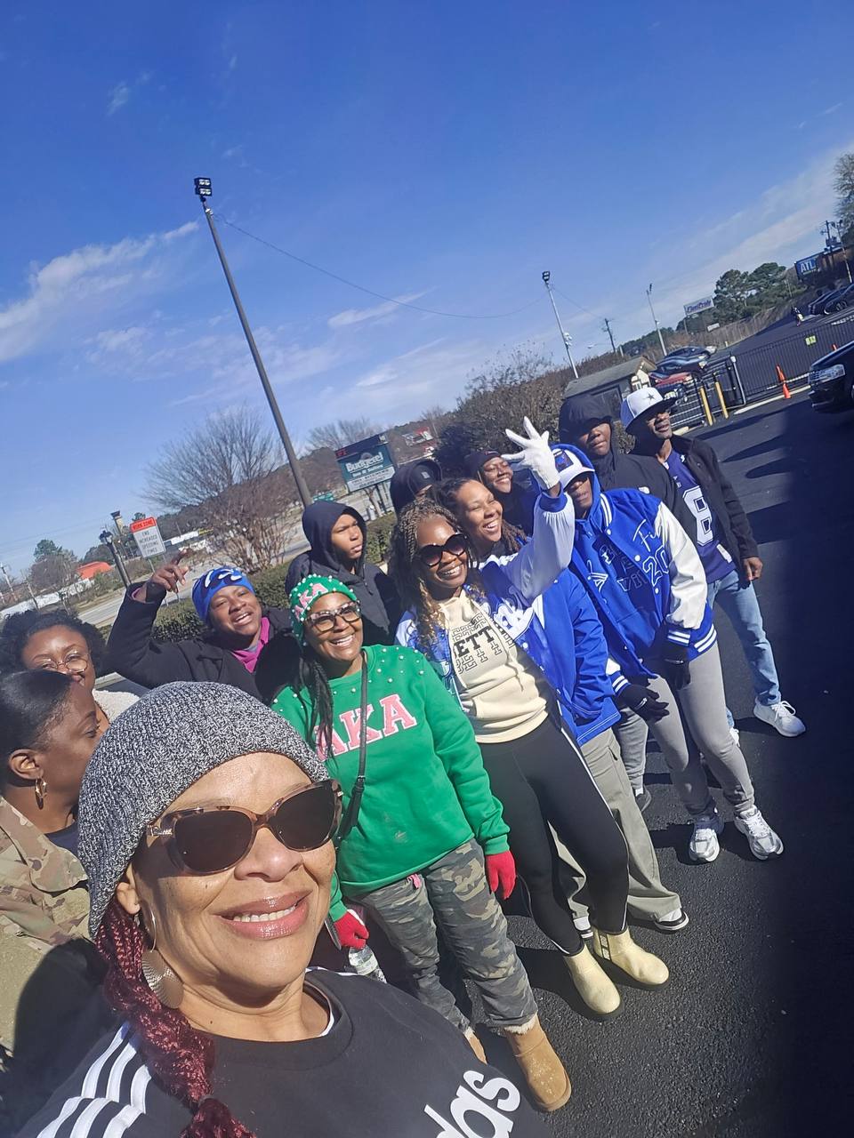 Volunteers gathered outdoors before a community outreach event