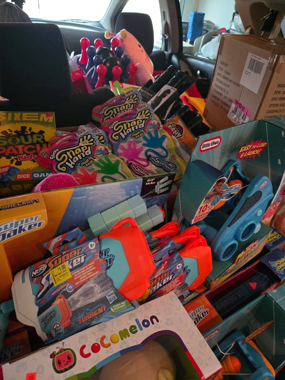 A vehicle filled with donated toys and games for a holiday giveback
