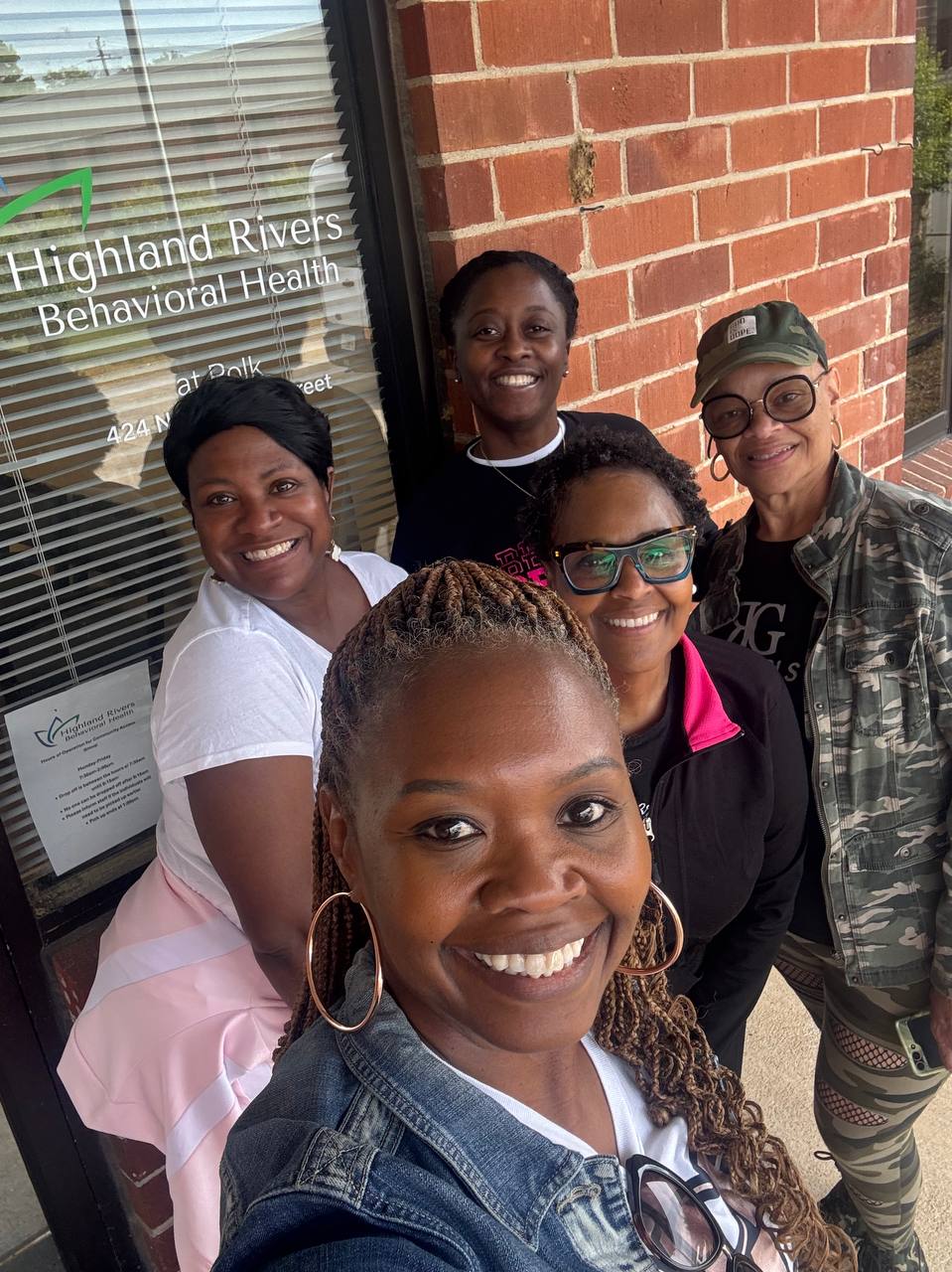 Rich Girls Foundation volunteers together outside a community partner location